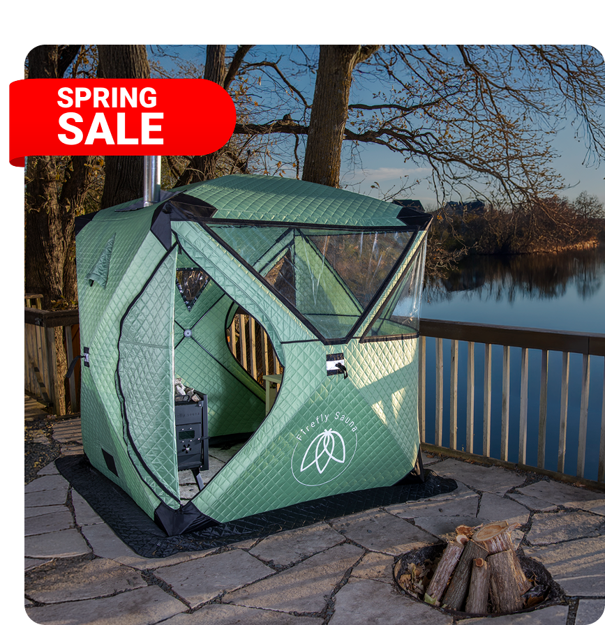 Firefly Spark tent on stone covered ground setup by a fire pit.